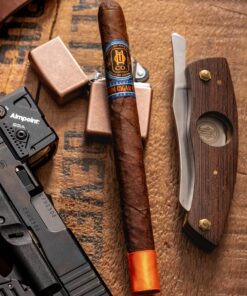 O.M Cigar Leather Cigar Case shown in an O.M. accessory display