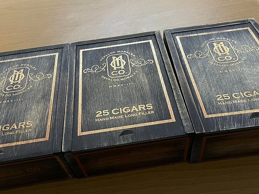 Essential Blend No. 4 box-pressed cigar | O.M. Cigars sampler Essential Blend No. 4 box-pressed cigar laid out for cigar comparison at O.M. Cigars