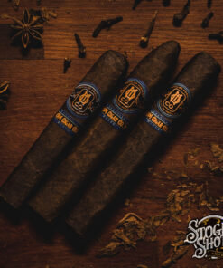 Essential Blend No. 4 box-pressed cigar laid out for cigar comparison at O.M. Cigars