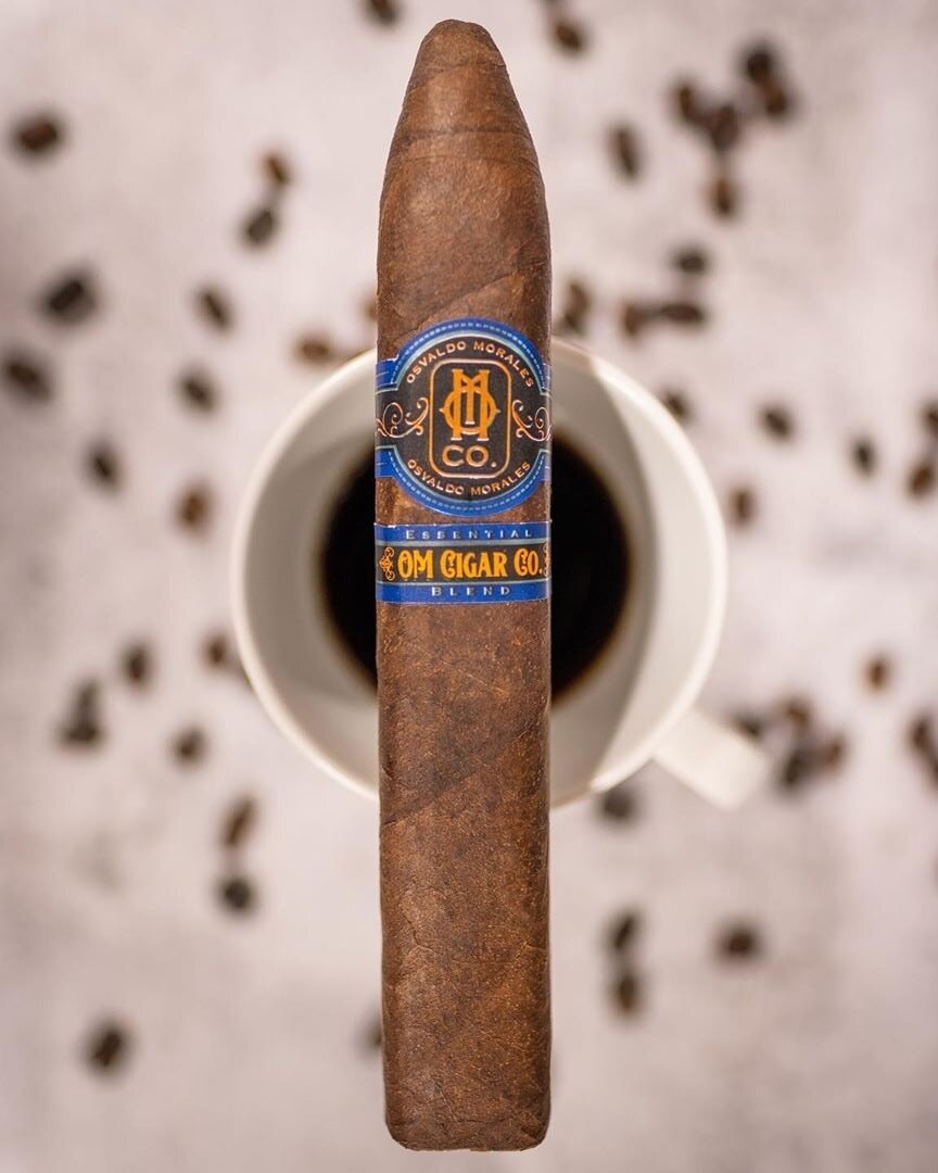Essential Blend No. 4 box-pressed cigar | O.M. Cigars sampler Essential Blend No. 4 box-pressed cigar laid out for cigar comparison at O.M. Cigars